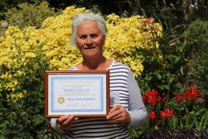 Pippa Logan with her award certificate